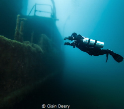 Sidemount diver on the wreck of the Niagara 2 at 30m dept... by Oisin Deery 